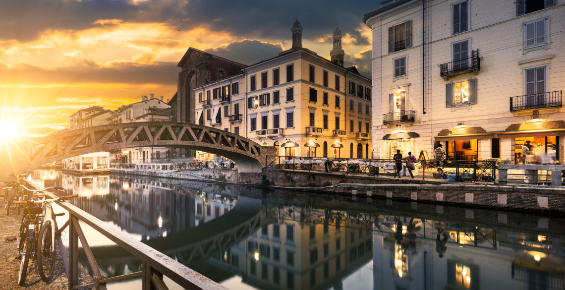 Bridge across the Naviglio Grande canal at the evening in Milan, Italy
